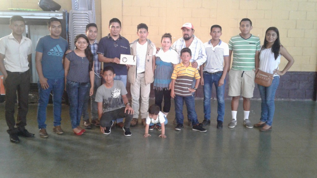 Members of the Youth Association for Development and Social Recovery stand with the family of Topacio Reynoso Pacheco, a youth leader who was killed in April 2013. The group is made up of professionals, students and working youth who want to contribute to the development of their municipality in an integral way through education, technology, art and political training. Photo: Lisa Rankin